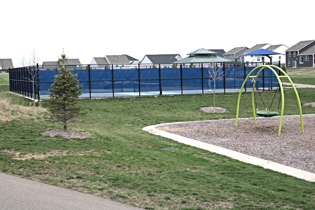 exterior space with a gazebo, fence, a residential view, and playground community
