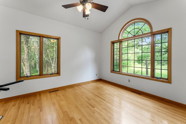 7884 341st St, Lent Twp, MN 55079 - empty room featuring wood finished floors, a ceiling fan, and vaulted ceiling