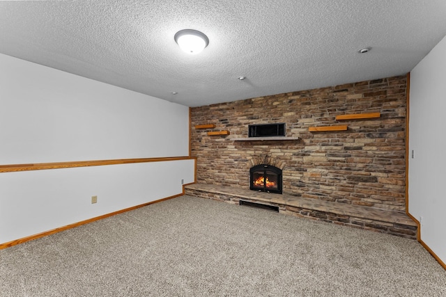 7884 341st St, Lent Twp, MN 55079 - unfurnished living room featuring carpet flooring, a textured ceiling, and a fireplace