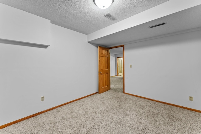 7884 341st St, Lent Twp, MN 55079 - unfurnished room with carpet and a textured ceiling