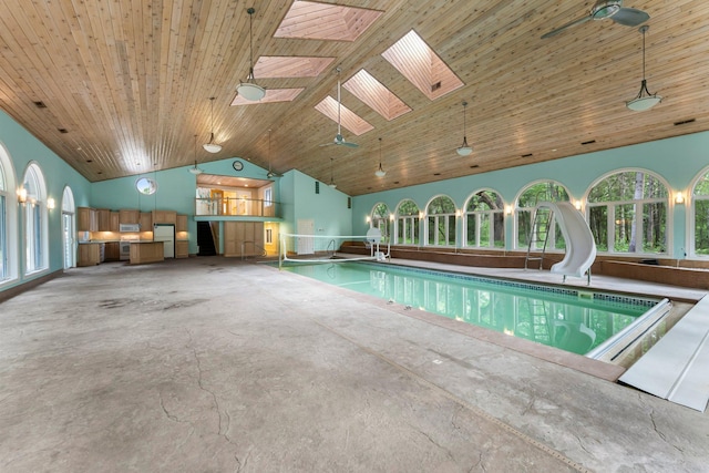 7884 341st St, Lent Twp, MN 55079 - indoor pool featuring a water slide and a skylight