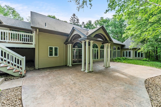 7884 341st St, Lent Twp, MN 55079 - view of front of house featuring a patio and a shingled roof