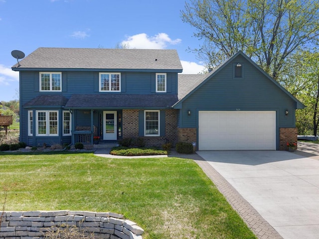 view of front of house with an attached garage, concrete driveway, a front lawn, and brick siding