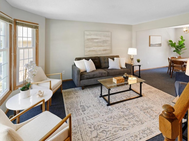 living area with carpet flooring and baseboards