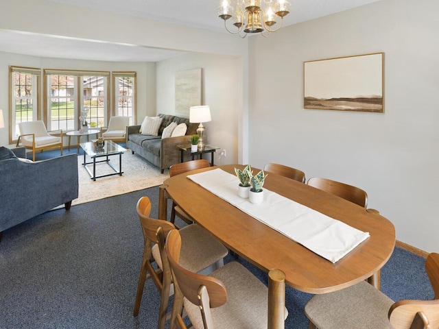 dining space with a chandelier