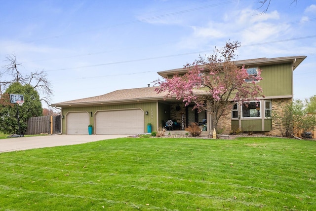 view of front of house with a garage, brick siding, fence, a front lawn, and concrete driveway