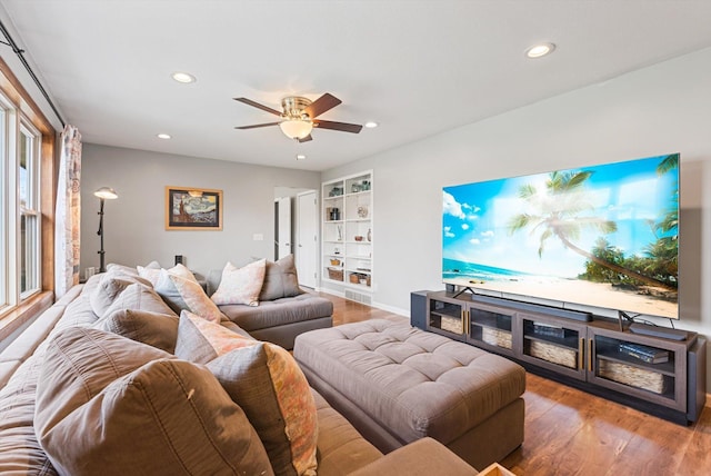 living room with visible vents, recessed lighting, a ceiling fan, and wood finished floors