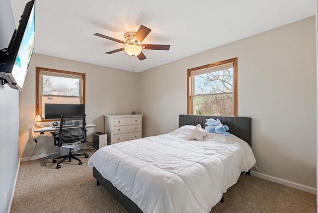 bedroom featuring baseboards, carpet flooring, and ceiling fan