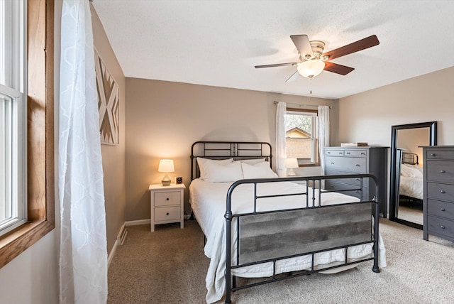 bedroom with baseboards, light carpet, and ceiling fan