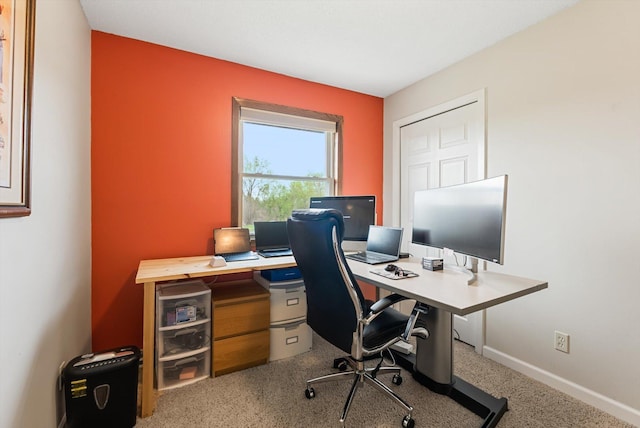 office space with baseboards and carpet