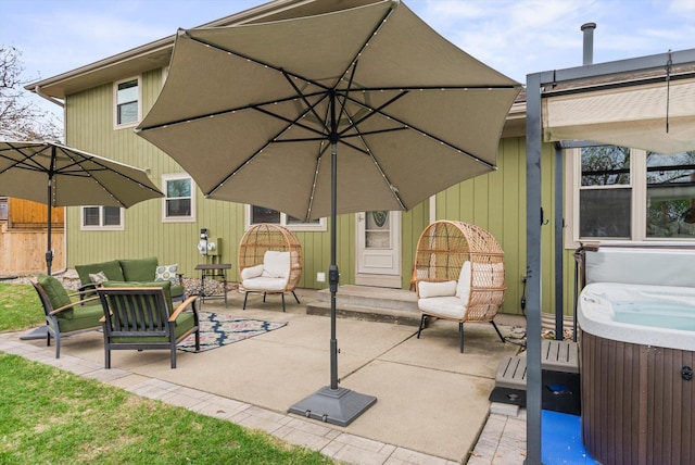 view of patio with central AC unit, outdoor lounge area, and a hot tub