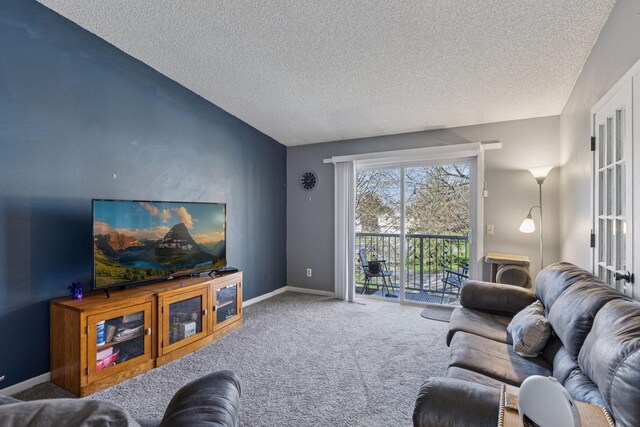 living room featuring baseboards, carpet flooring, a textured ceiling, and vaulted ceiling