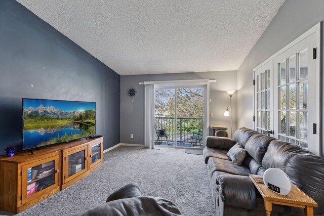 carpeted living room featuring baseboards, a textured ceiling, and vaulted ceiling