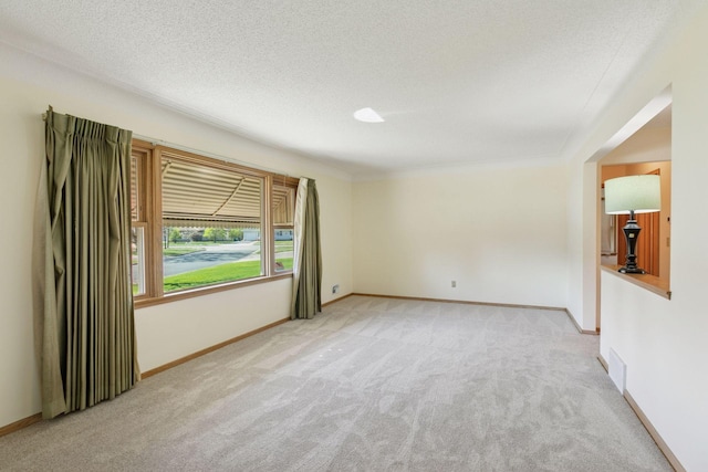 6309 Halifax Dr, Brooklyn Center, MN 55429 - carpeted spare room featuring baseboards and a textured ceiling