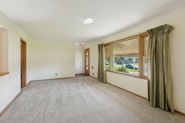 6309 Halifax Dr, Brooklyn Center, MN 55429 - carpeted spare room with a textured ceiling and baseboards