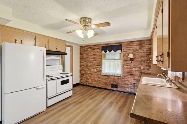 6309 Halifax Dr, Brooklyn Center, MN 55429 - kitchen featuring a ceiling fan, brick wall, white appliances, under cabinet range hood, and a sink