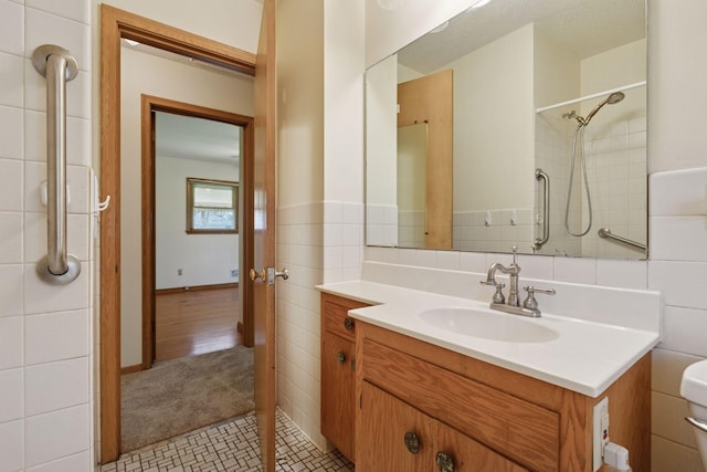 6309 Halifax Dr, Brooklyn Center, MN 55429 - full bath with tile walls, tile patterned floors, a wainscoted wall, vanity, and toilet