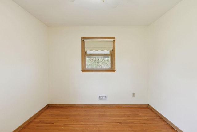 6309 Halifax Dr, Brooklyn Center, MN 55429 - unfurnished room with baseboards, light wood-style flooring, and visible vents