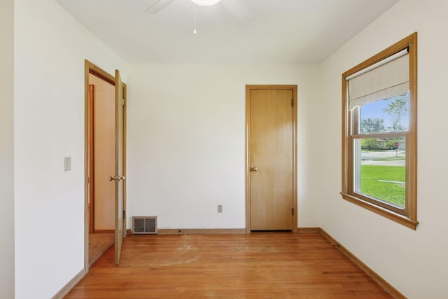 6309 Halifax Dr, Brooklyn Center, MN 55429 - unfurnished bedroom featuring visible vents, light wood finished floors, ceiling fan, and baseboards