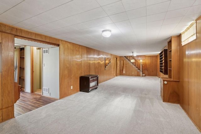6309 Halifax Dr, Brooklyn Center, MN 55429 - finished basement with carpet floors, wood walls, and visible vents