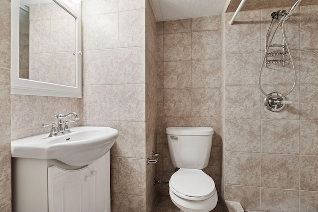 6309 Halifax Dr, Brooklyn Center, MN 55429 - bathroom with vanity, tile walls, toilet, and tiled shower