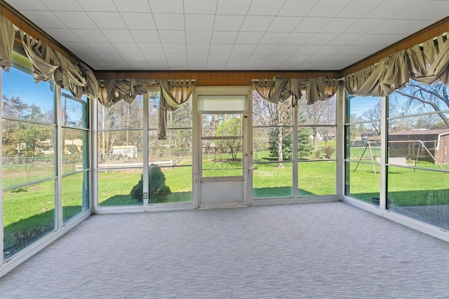 6309 Halifax Dr, Brooklyn Center, MN 55429 - unfurnished sunroom with a healthy amount of sunlight