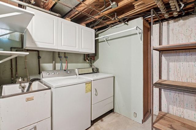 6309 Halifax Dr, Brooklyn Center, MN 55429 - clothes washing area with a sink, cabinet space, and washing machine and dryer