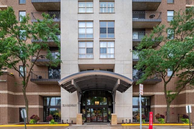 view of property featuring uncovered parking