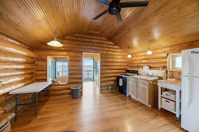 23920 Camp Dr, Daniels Twp, WI 54872 - kitchen featuring gas range oven, freestanding refrigerator, wooden ceiling, a sink, and ceiling fan