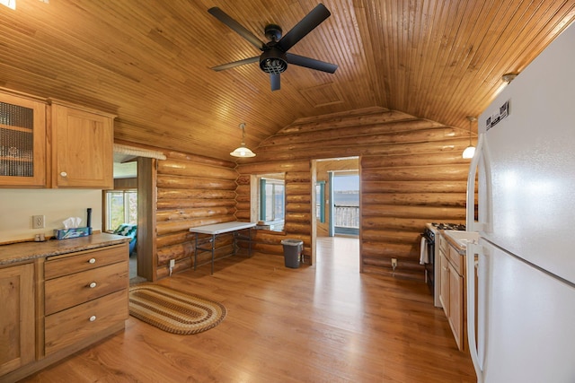 23920 Camp Dr, Daniels Twp, WI 54872 - kitchen with freestanding refrigerator, gas stove, wood ceiling, a ceiling fan, and rustic walls