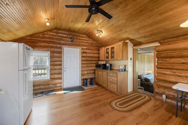 23920 Camp Dr, Daniels Twp, WI 54872 - kitchen with freestanding refrigerator, wooden ceiling, ceiling fan, vaulted ceiling, and glass insert cabinets