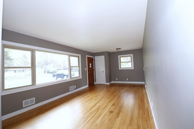 10424 Washburn Ave S, Bloomington, MN 55431 - empty room with light wood-style flooring and baseboards