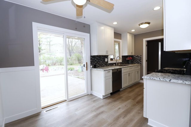 10424 Washburn Ave S, Bloomington, MN 55431 - kitchen with dishwasher, a sink, backsplash, ceiling fan, and light wood-style floors
