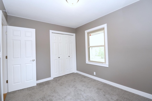 10424 Washburn Ave S, Bloomington, MN 55431 - unfurnished bedroom with carpet floors, baseboards, and a closet