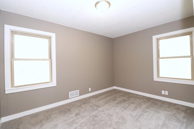 10424 Washburn Ave S, Bloomington, MN 55431 - unfurnished room featuring healthy amount of natural light, carpet floors, and baseboards
