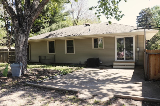 10424 Washburn Ave S, Bloomington, MN 55431 - back of house featuring fence, a patio area, entry steps, and a shingled roof