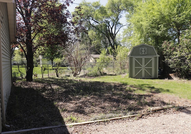 10424 Washburn Ave S, Bloomington, MN 55431 - view of yard featuring a storage unit, fence, and an outbuilding