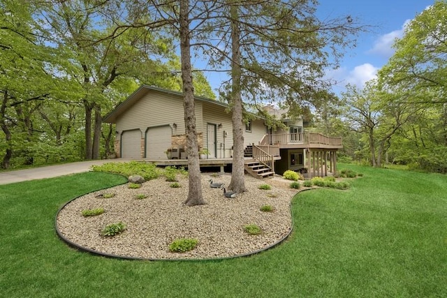 16523 243rd Ave NW, Orrock Twp, MN 55309 - view of front of house featuring a wooden deck, concrete driveway, a front lawn, and stairs