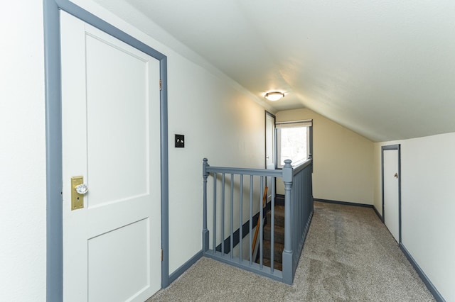 bonus room featuring carpet floors, baseboards, and lofted ceiling