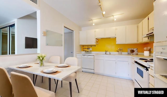 kitchen with white appliances, a sink, light countertops, under cabinet range hood, and light tile patterned floors
