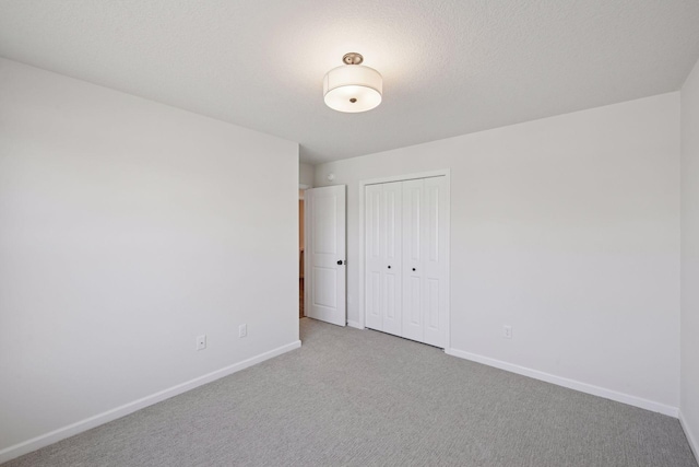 spare room with carpet flooring and baseboards