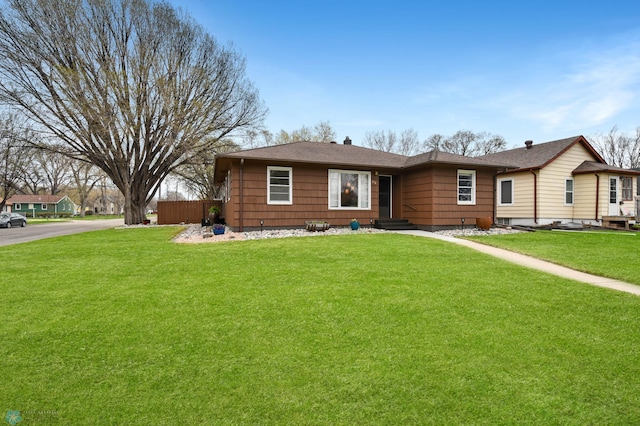 ranch-style home with a front yard