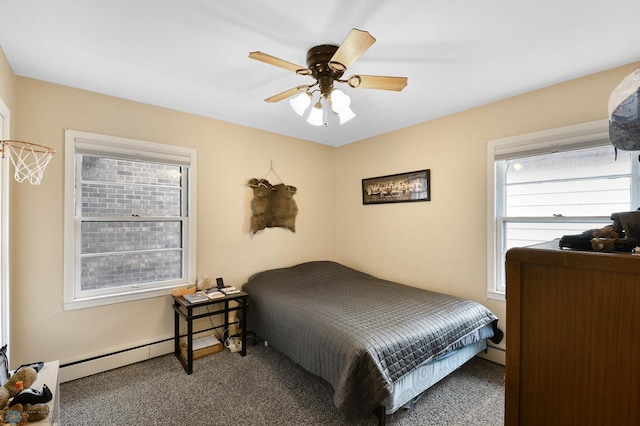 bedroom with carpet, ceiling fan, and baseboard heating