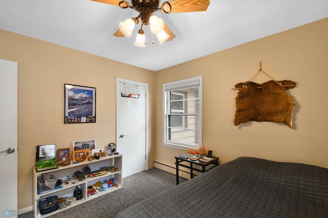 carpeted bedroom with baseboard heating and a ceiling fan