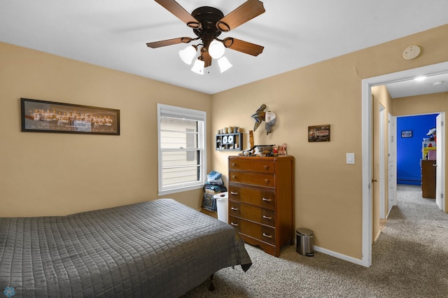 bedroom featuring carpet floors, baseboards, and ceiling fan