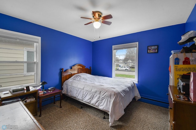 carpeted bedroom featuring ceiling fan