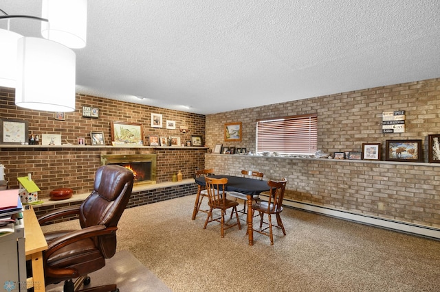 dining area featuring carpet flooring, a fireplace, a textured ceiling, brick wall, and a baseboard radiator