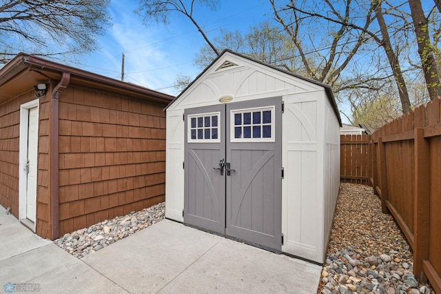 view of shed featuring a fenced backyard