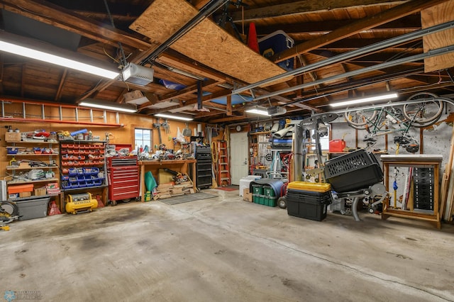 garage featuring a workshop area and a garage door opener