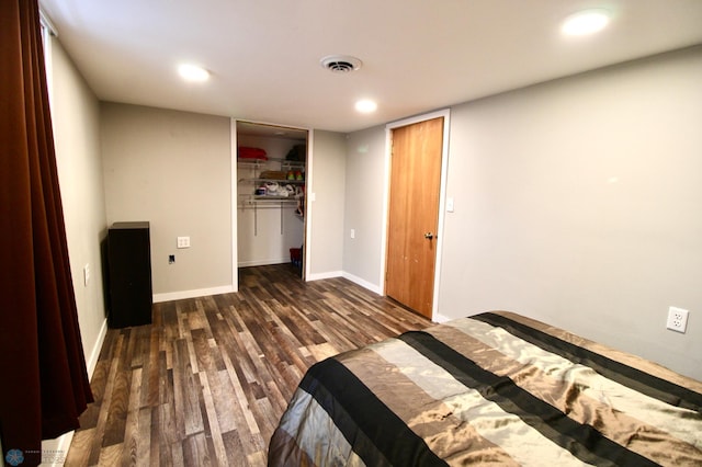 unfurnished bedroom featuring recessed lighting, baseboards, visible vents, and wood finished floors